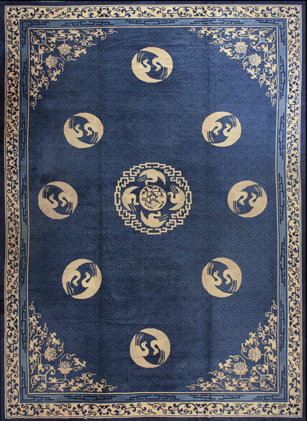 Deep blue rug with an interlocking lattice field and tan border featuring nine circular bird medallions.