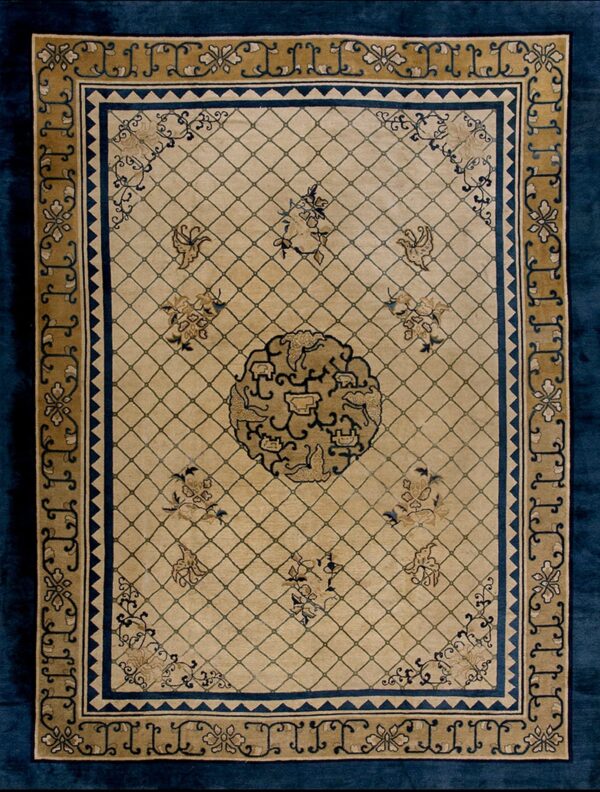 A beige rug features a diamond trellis pattern, a central medallion, and navy blue and gold stylized borders.
