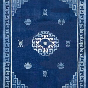 Deep blue rug with geometric light blue Greek key border and stylized central and corner motifs.