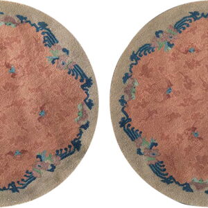 Two identical circular rugs with pink centers and blue scalloped decorative borders.