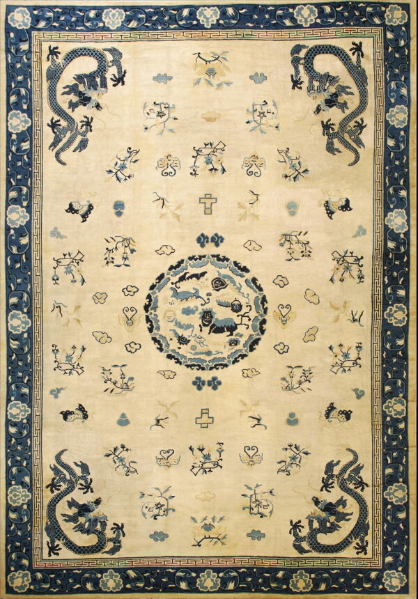Cream field rug featuring stylized navy blue corner dragons, scattered symbols, and a wide floral border.