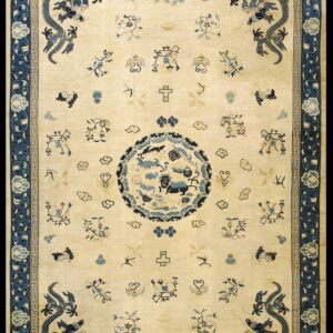 Cream field rug featuring four dark blue corner dragons, a central medallion, and elaborate blue borders.