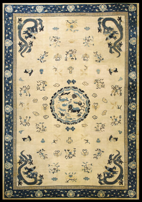 Cream field rug featuring four dark blue corner dragons, a central medallion, and elaborate blue borders.