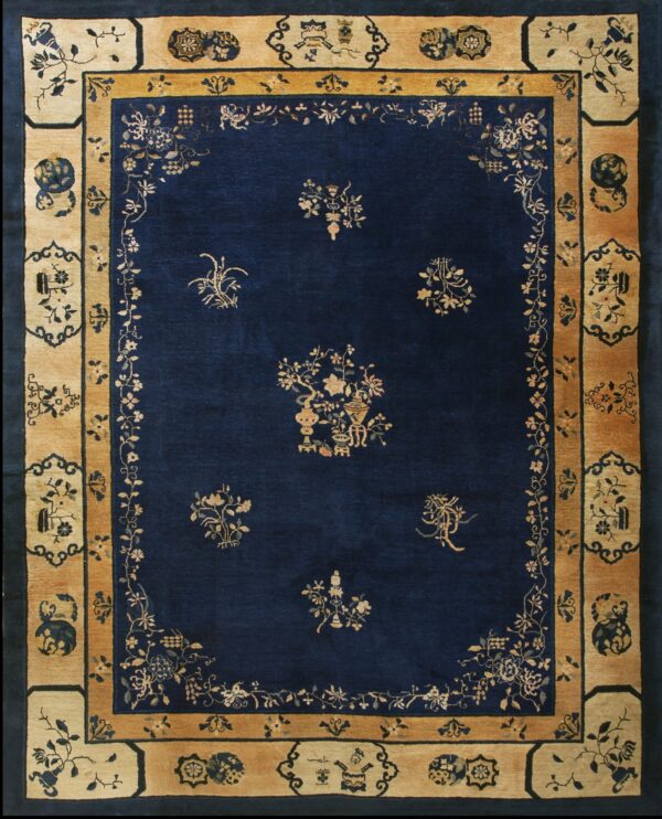 Blue antique rectangle 1920s wool hand knotted pile rug 1 Rectangular rug with a dark blue field and contrasting golden tan border featuring floral and decorative panels.