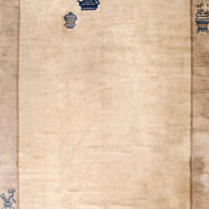 Elegant ivory rug with blue motifs.