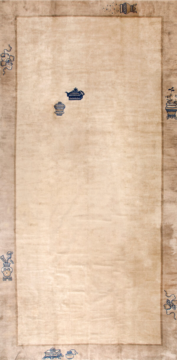 Elegant ivory rug with blue motifs.