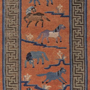 Orange rug with blue horse figures and geometric landscape motifs, set inside a gray meander border.