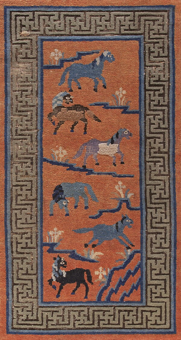 Orange rug with blue horse figures and geometric landscape motifs, set inside a gray meander border.