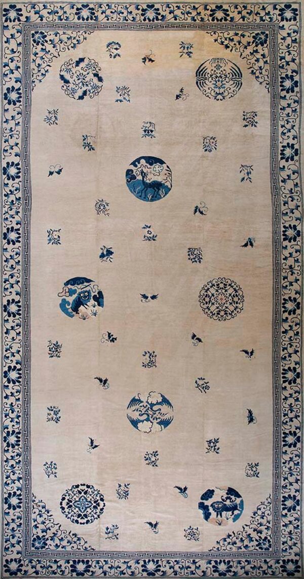 Elegant ivory rug with blue motifs.