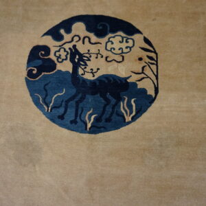 Deer motif on beige wool rug