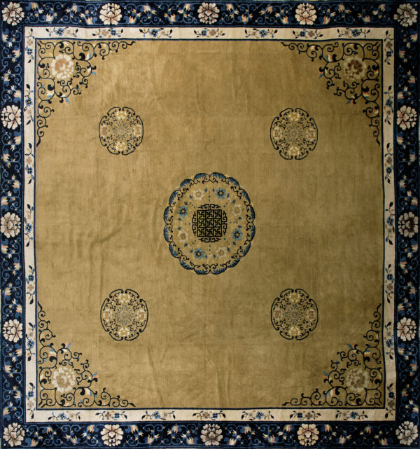 Gold rug with navy and cream floral borders framing five intricate circular medallions.