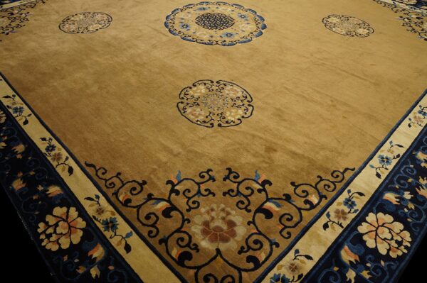 Plush golden brown rug with deep blue, beige, and tan floral medallions and ornate scroll borders.