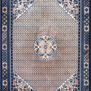 Navy and beige traditional rug featuring a central medallion, scrolling corners, and complex geometric borders.