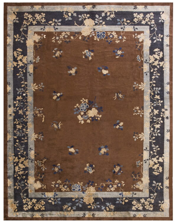 Dark brown rug featuring scattered blue and cream flowers surrounded by multi-layered navy and gray borders.
