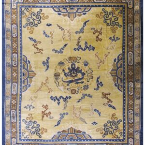 Saffron-yellow rug featuring a detailed central blue dragon and intricate blue and brown geometric borders.