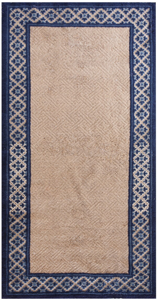 Beige runner rug featuring a subtle textured diagonal pattern framed by a detailed navy and light blue border.