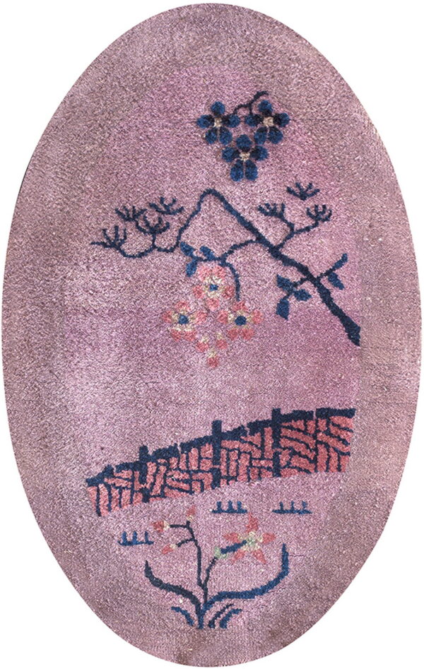 Oval mauve rug with stylized dark blue botanical designs and a horizontal geometric pattern.