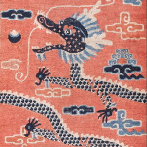Coral rug with a central dark blue dragon design, light blue clouds, and detailed scroll borders.