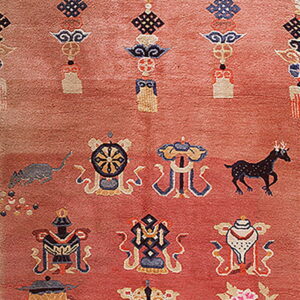 Dusty rose runner rug panel displays intricate symbolic designs, colorful borders, and stylized animal and cloud motifs.
