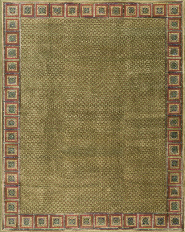 Green rug featuring a dense overall geometric pattern and a structured red border with alternating blue square motifs.