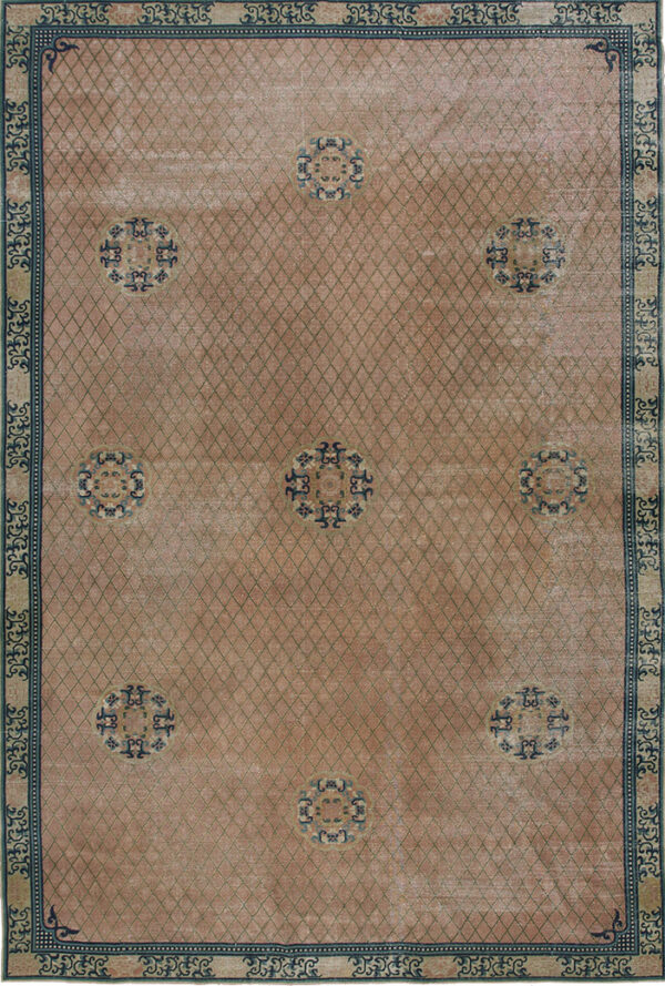 Distressed pink rug featuring a teal diamond trellis background and nine circular floral medallions.