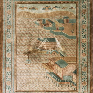 Muted green and tan pictorial rug depicting a waterfront village framed by wide floral borders.