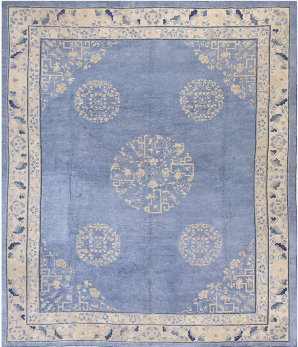 Blue traditional rug with five beige circular medallions and an elaborate multi-band border.