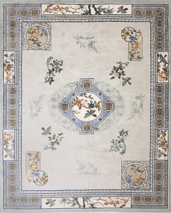 Elaborate pale sage rug with detailed blue borders and central bird and flower medallions.
