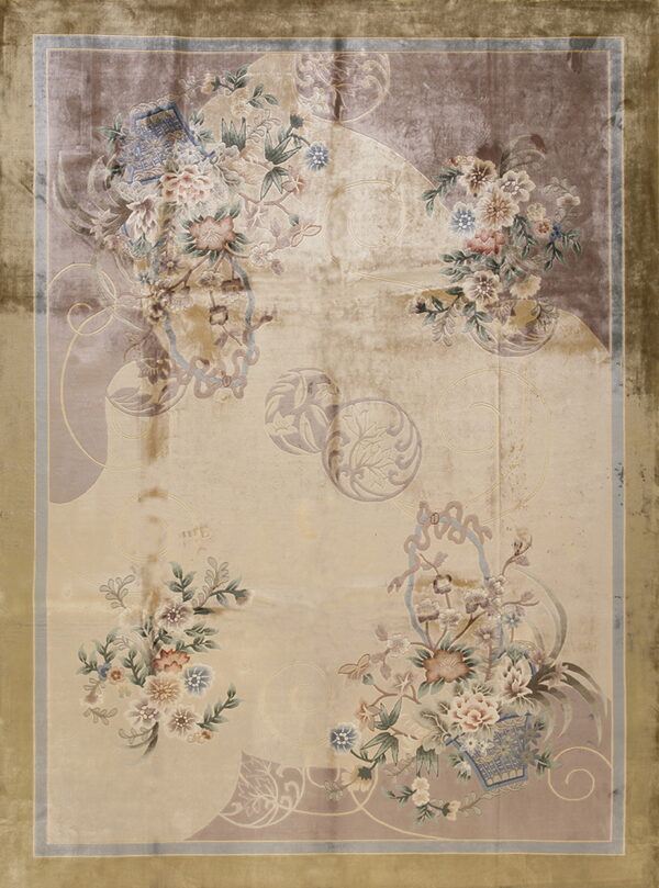 Low-pile rug with a shimmering beige field, muted floral clusters, and a wide golden olive green border.