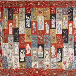 Intricate embroidered textile with columns of colorful patch blocks depicting figures and scrolling floral vines on a red ground.