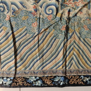 Wavy blue and gold diagonal pattern with swirling cloud motifs and a black embroidered floral and knotwork border.