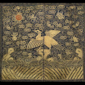 Dark navy textile with intricate gold swirling cloud and bird motifs over geometric waves.