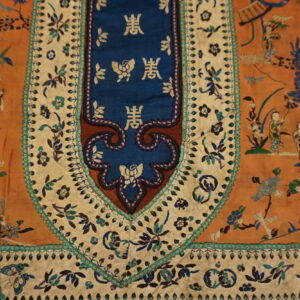 Highly detailed rust textile featuring embroidered figures, a blue dragon, and a central blue panel with gold script.