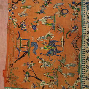 Terracotta flat textile embroidered with colorful traditional figures, trees, and ornate blue and cream multiple borders.