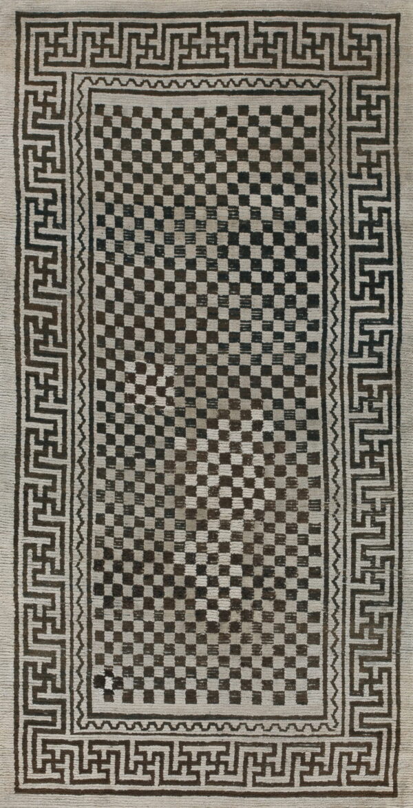 Textural off-white and dark brown rug featuring a checkerboard field and geometric meander border.