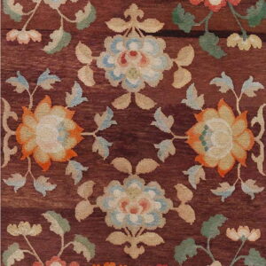 Reddish-brown rug featuring stylized floral motifs in cream, pale blue, orange, and green.