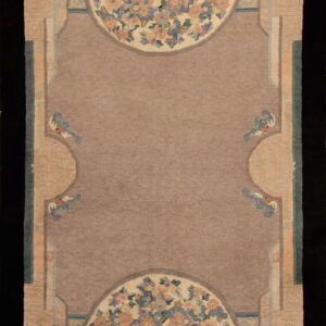 Mauve rug with a wide stylized border and semicircular floral panels in peach, blue, and cream.