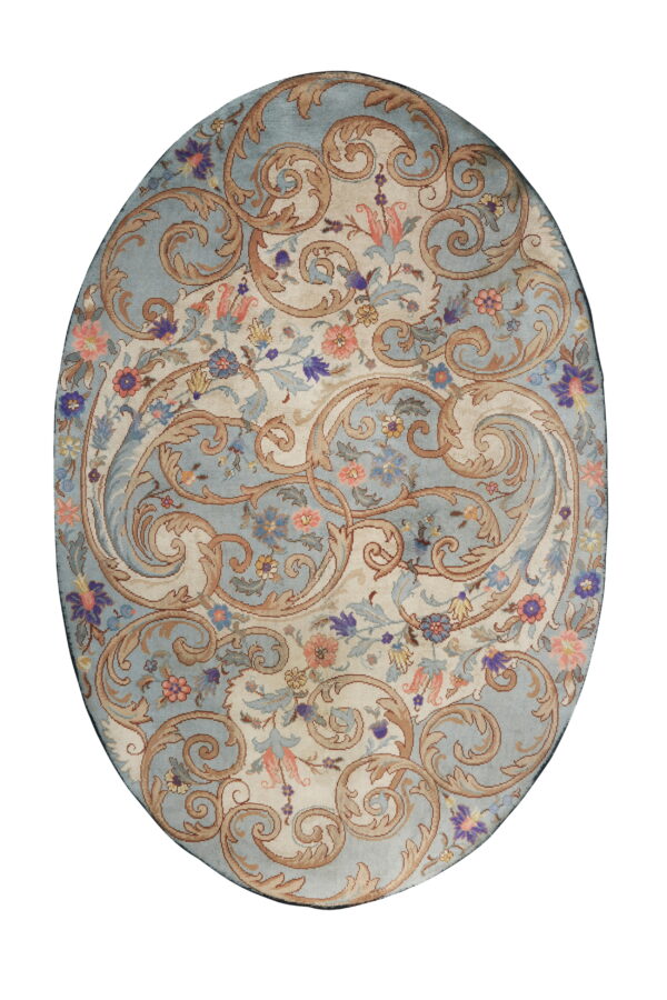 Ornate oval rug displaying tan scrolls and multi-colored flowers across alternating blue and ivory fields.