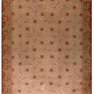 High pile rug with a red floral border surrounding a central field of mauve and gold botanical motifs.