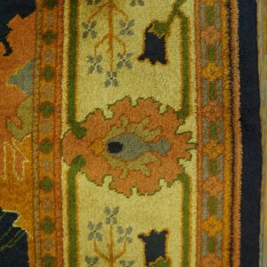 High-pile rug detail showing floral patterns in yellow, orange, navy, green, and gray.