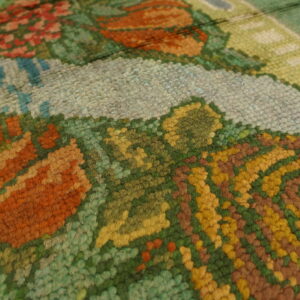 Colorful floral pattern on textured rug