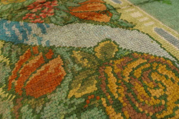 Colorful floral pattern on textured rug