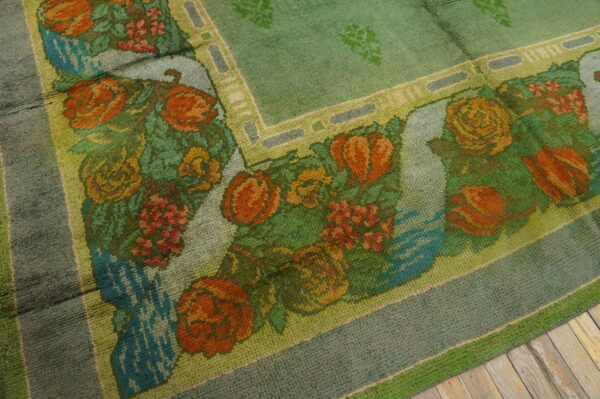 Floral patterned green wool area rug