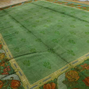 Large green floral patterned area rug