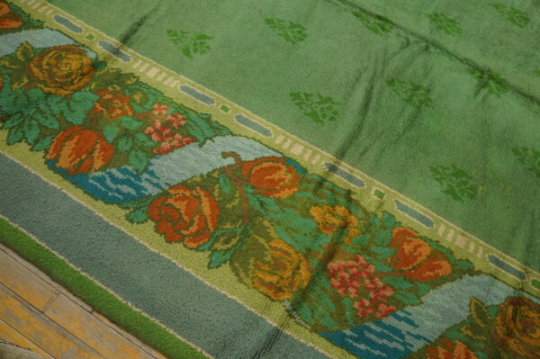 Colorful floral pattern on green rug
