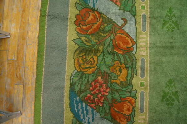 Colorful floral pattern on green rug