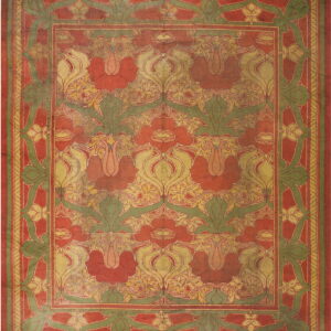 Red rug with repeating olive green and gold stylized floral designs and wide patterned borders.