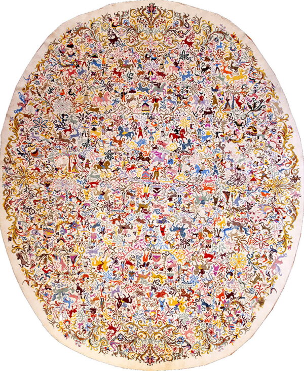Oval off-white rug covered in a dense, detailed pattern of brightly colored people and animals.