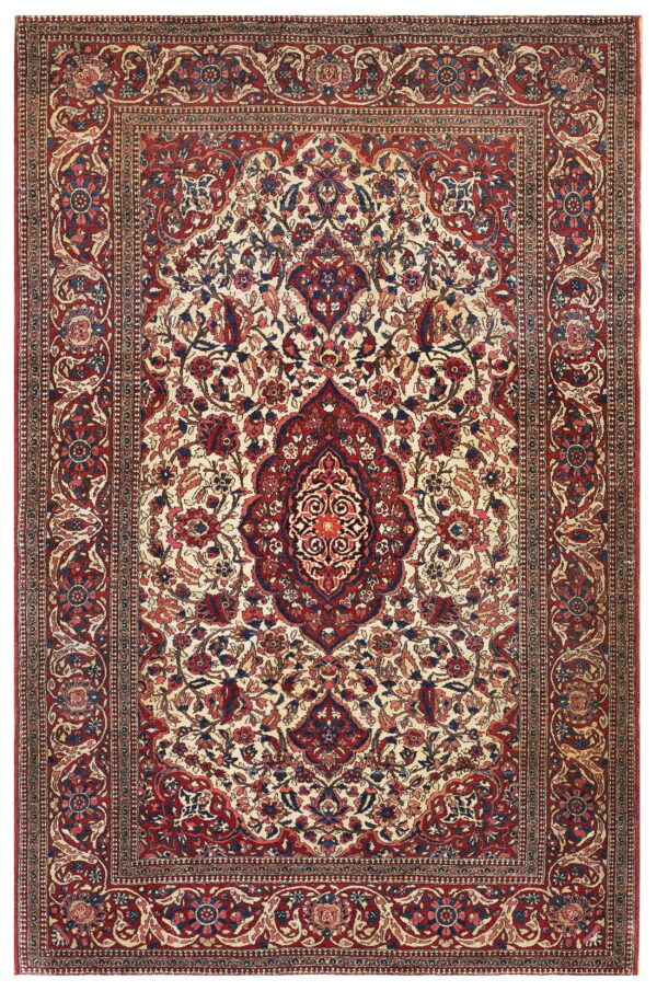 Red and navy traditional rug with a central medallion and dense floral design on a cream field.