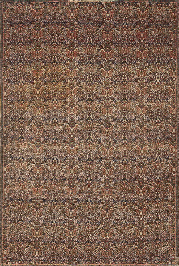 Ornate low-pile rug featuring a dense repeating traditional pattern in navy blue, rust, and cream tones.